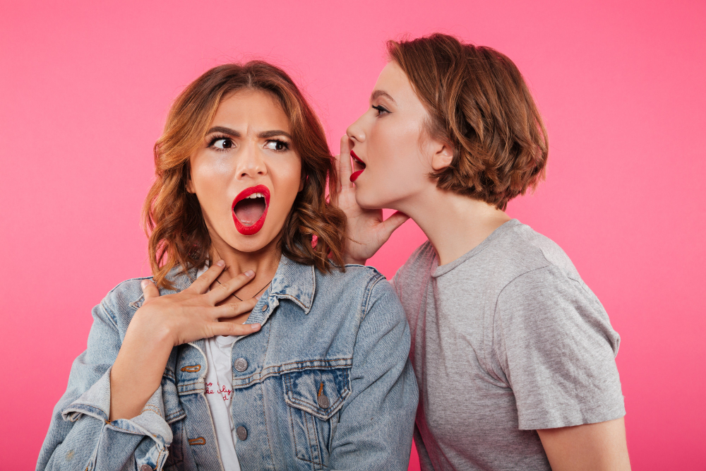shocked two women friends gossiping