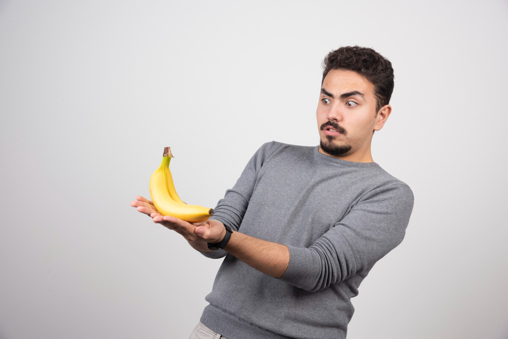 young man looking banana gray